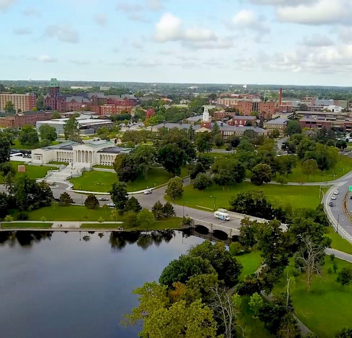 Drone view of Delaware park and Elmwood Ave, facing the campus front.