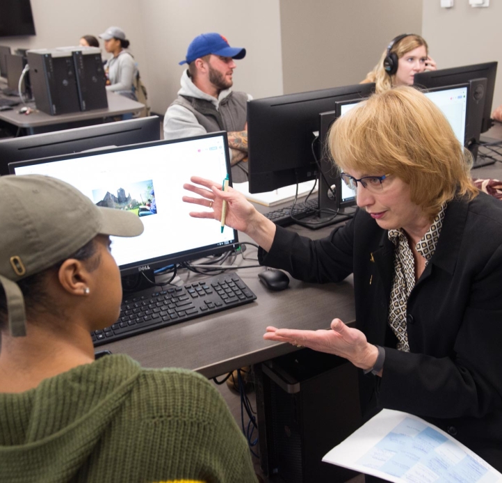 Annemarie Franczyk's speaking to a student in class.