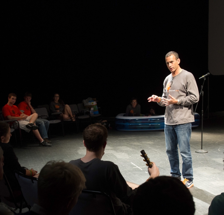 Drew Kahn addressing an audience at the Anne Frank Project