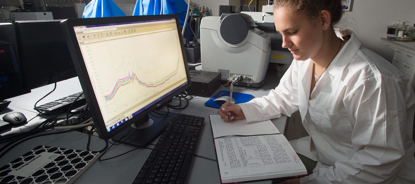 Student studying data in a chemistry lab