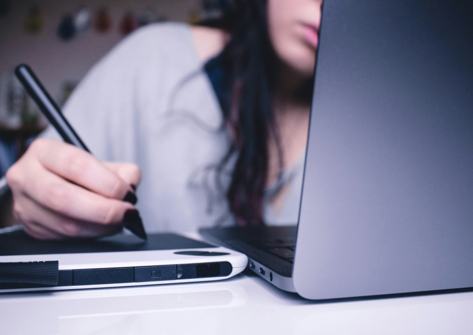 Student taking notes with an assistive technology device